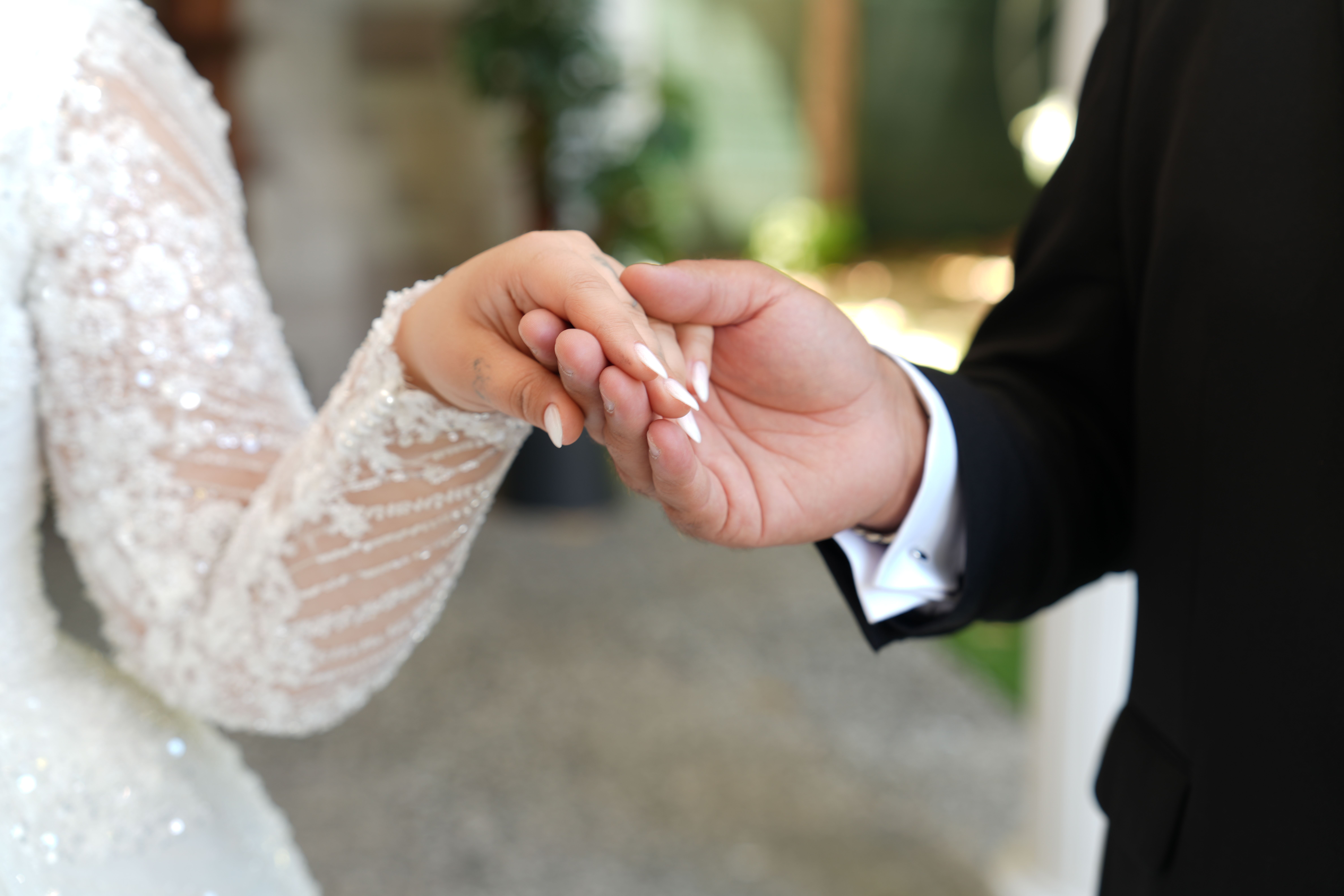 A Muslim couple holding hands after a halal marriage